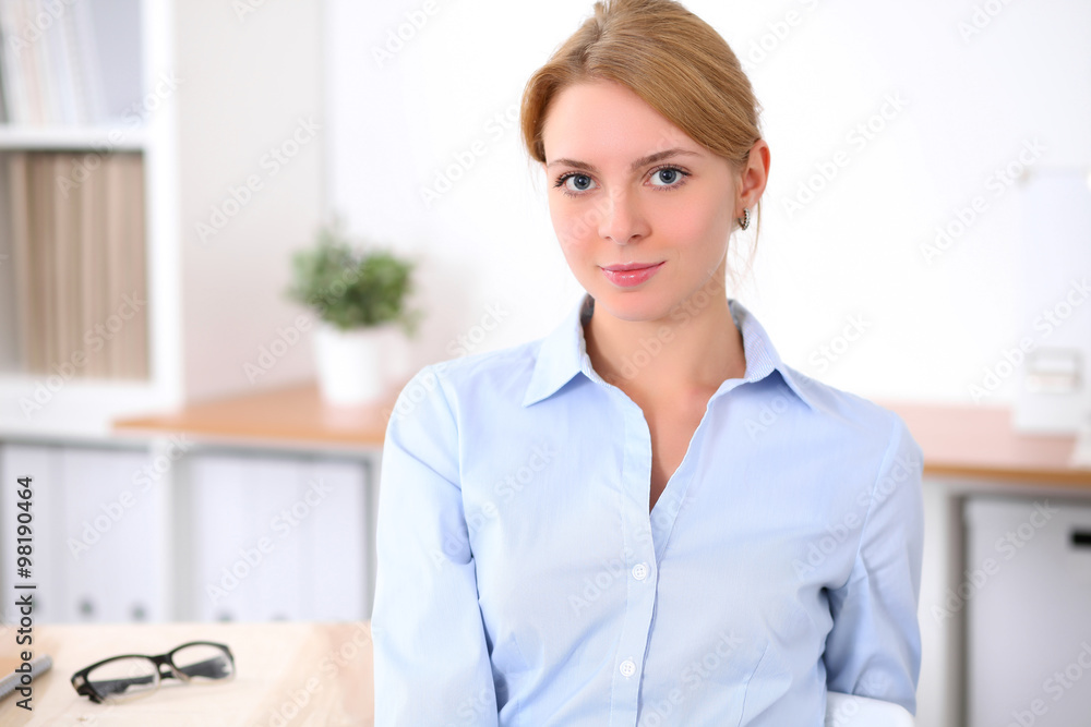Young blonde business woman with laptop in the office. Business concept. Young blonde business woman with laptop in the office. Business concept.