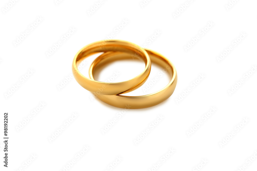 Golden wedding rings isolated on a white