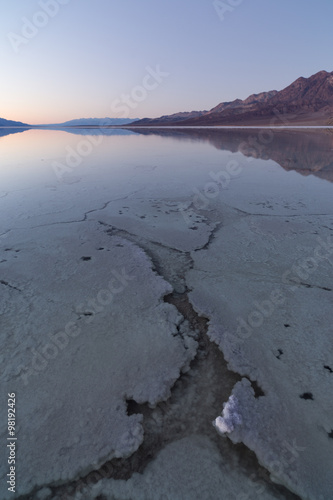 A very rare scenario of a flooded Badwater. There is about 3 inches of water covering the salty valley floor.