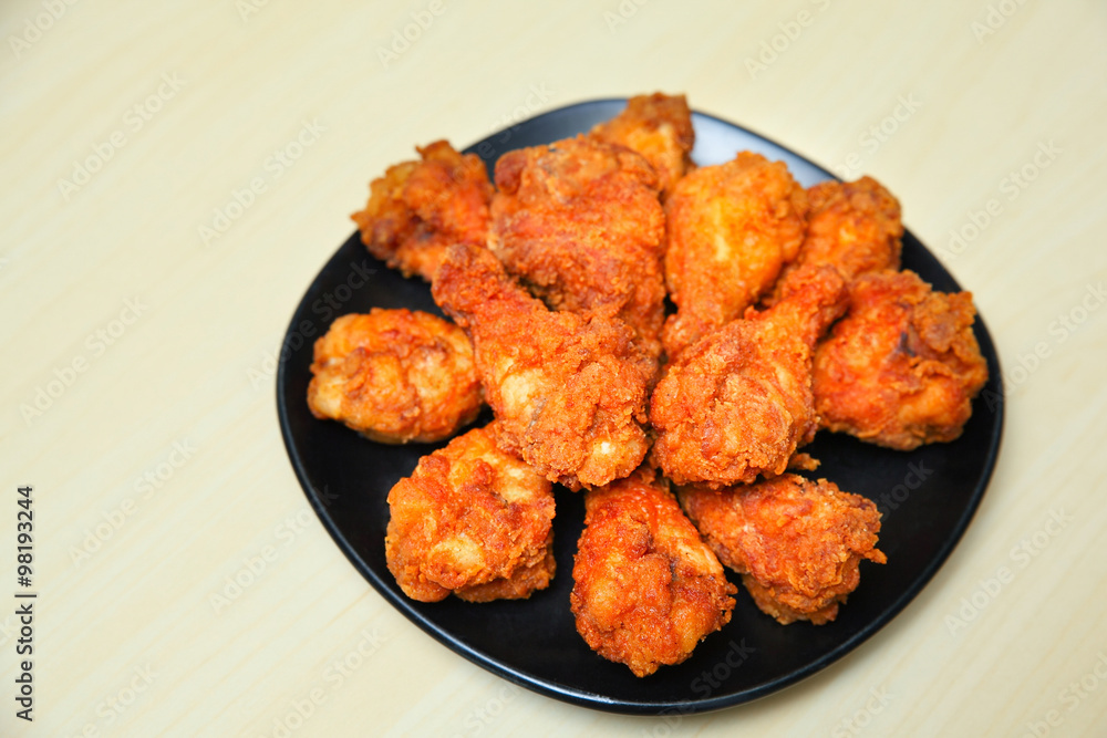 Fried chicken on wooden background Fried chicken on wooden background
