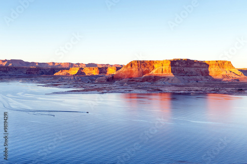 two boats floating on the lake Powell between the rocks of the c