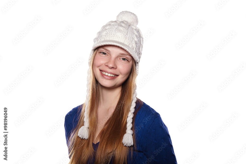 Portrait of girl in sweater and cap on white background Portrait of girl in sweater and cap on white background