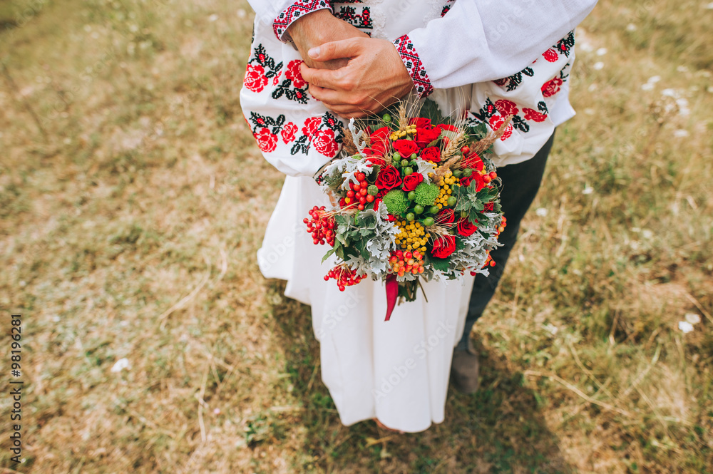 Woman holding wedding flowers bouquet