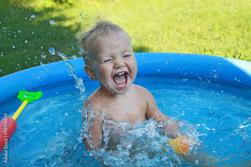 White Baby European appearance emotionally plays sprinkles in a