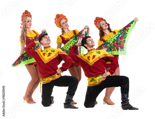 Dancer team wearing a folk costumes isolated on white