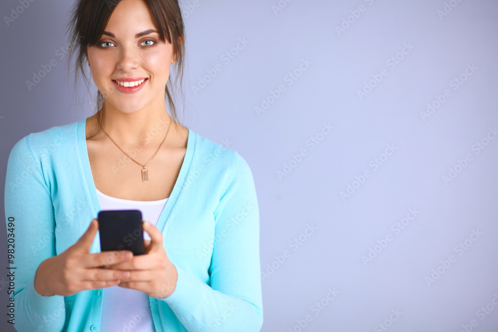 Woman using and reading a smart phone Woman using and reading a smart phone