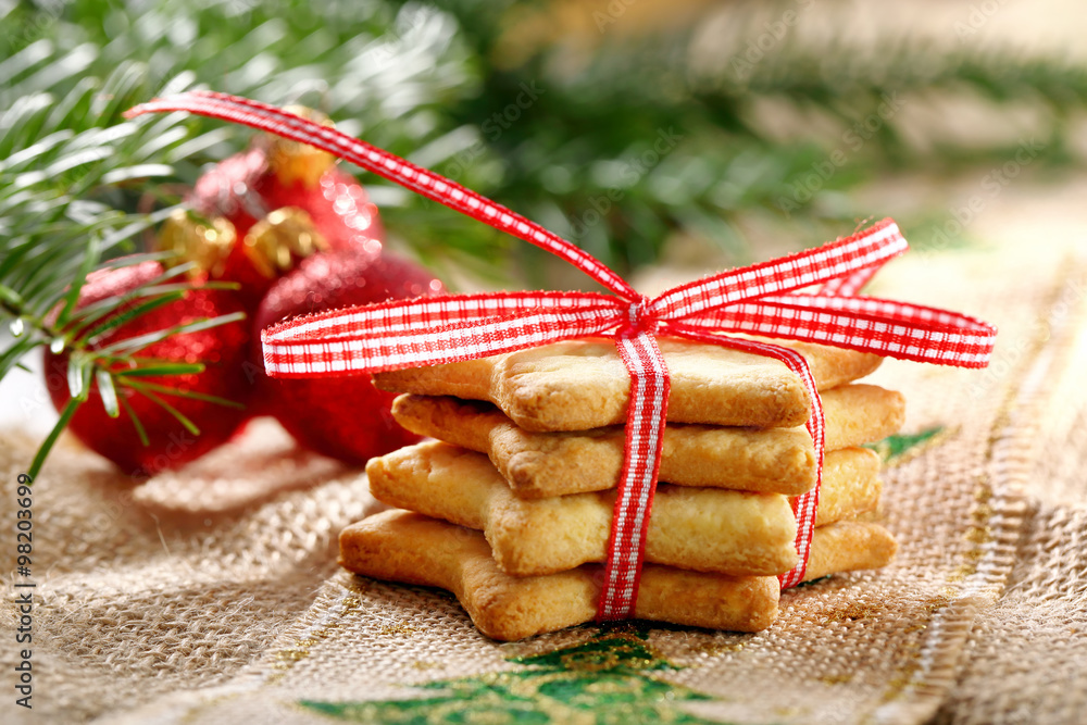 Christmas cookies with decoration on wooden background