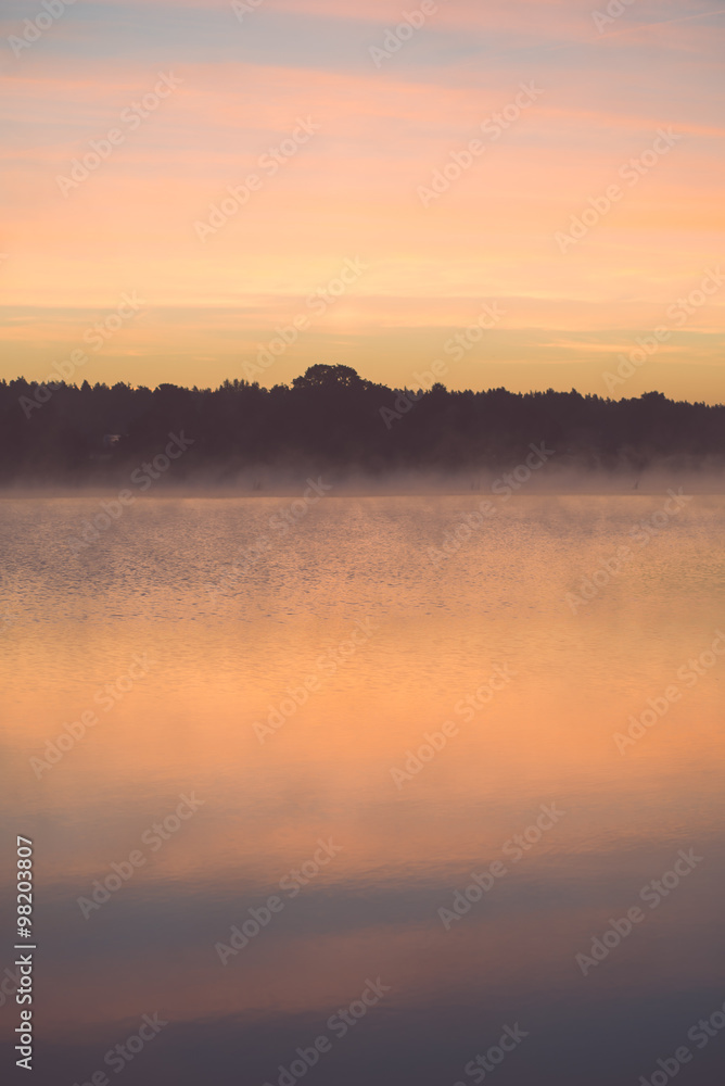 Fototapeta premium Foggy morning on the country lake - vintage effect