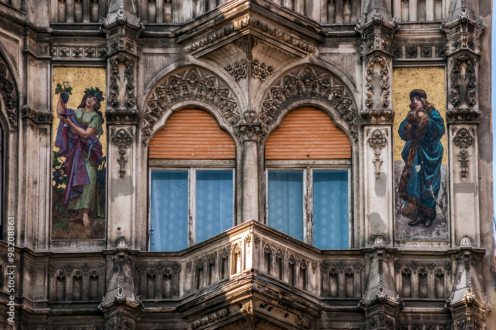 Architectural balcony of a public building in Budapest, Hungary. It is decorated with mosaics depicting female figures