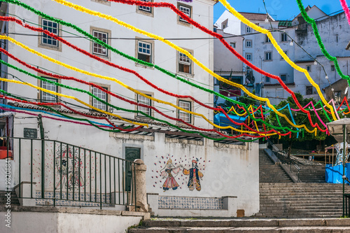Stairs of San Miguel in Alfama neighborhood, adorned with many colors during the holidays of San Antonio. They are celebrated in the month of June in Lisbon, the capital of Portugal