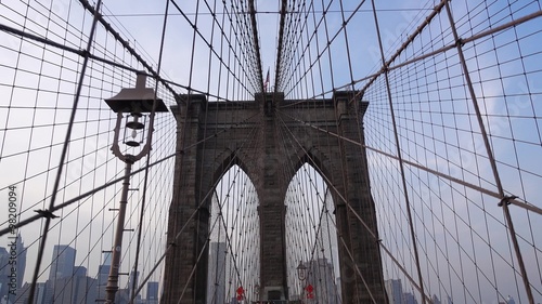 NEW YORK - Circa December, 2015 - A personal perspective walking over the Brooklyn Bridge headed to Manhattan.	 	