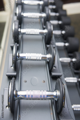 rows of dumbbells in fitness room