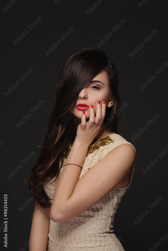 Portrait of a beautiful brunette with hand on face Portrait of a beautiful brunette with hand on face