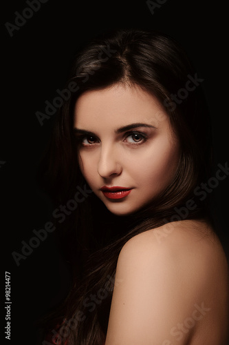 Close-up portrait of beautiful woman with red lipstick