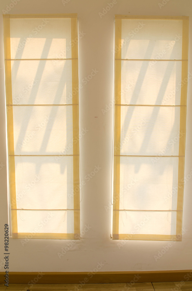Shadow from shining through a window and the curtains, in room Shadow from shining through a window and the curtains, in room