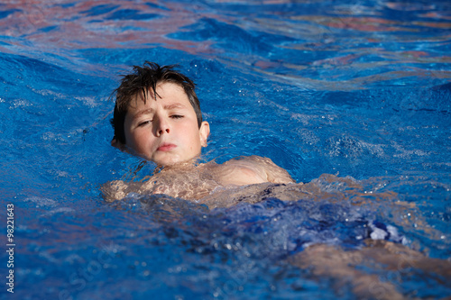 Boy swimm in pool