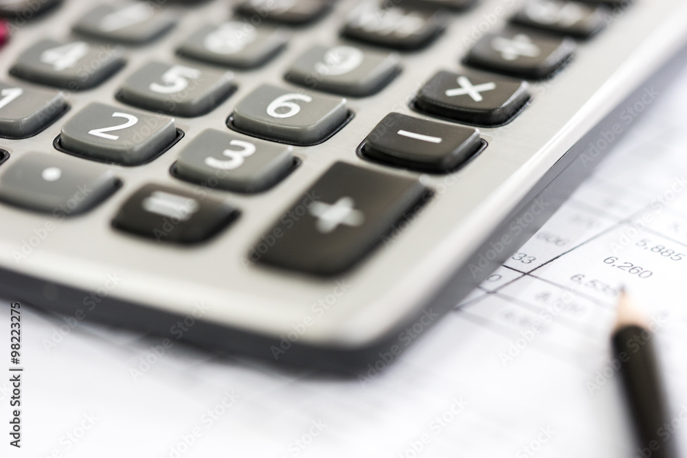 Calculator on the Financial table with pencil Calculator on the Financial table with pencil