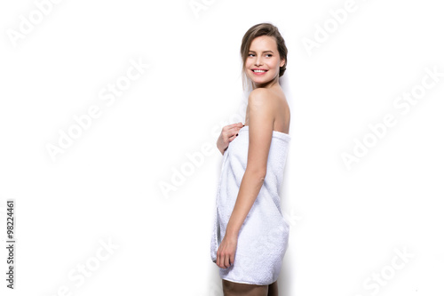 beautiful young woman with bath towel on the body photo
