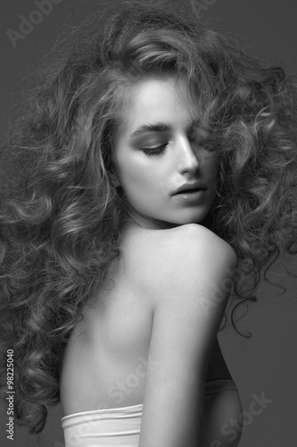 Fotografie Beautiful woman with curly hairstyle