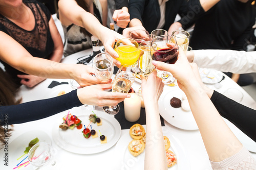 Clinking glasses and toasting