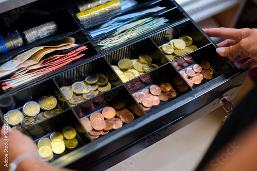 Open cash till containing Euros