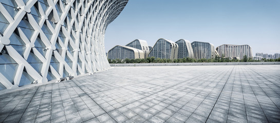 cloudy skyline and empty ground front of buildings