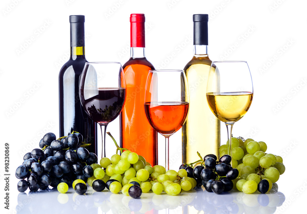 bottles and glasses of wine with grapes