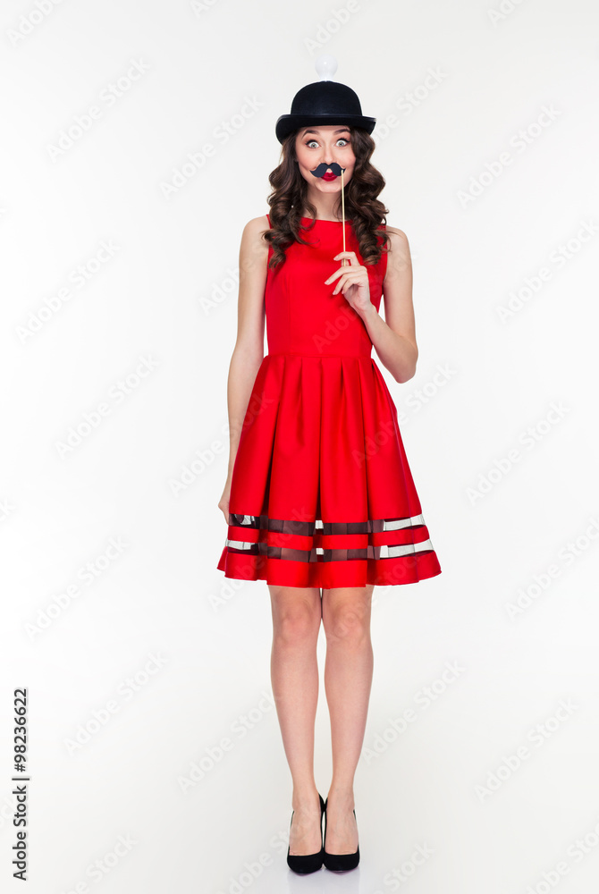Comical woman in hat with light bulb holding fake moustache Comical woman in hat with light bulb holding fake moustache