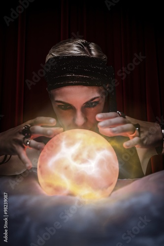 Composite image of fortune teller forecasting the future