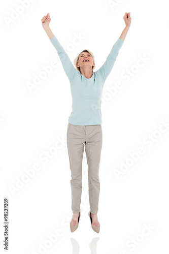 happy senior woman jumping