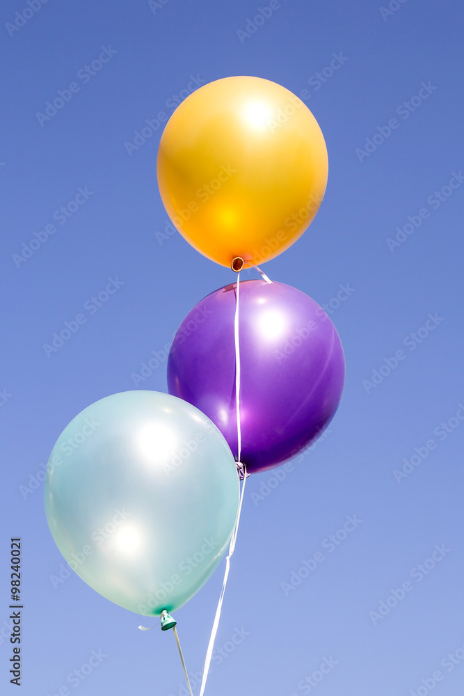 colorful balloons isolated on blue colorful balloons isolated on blue