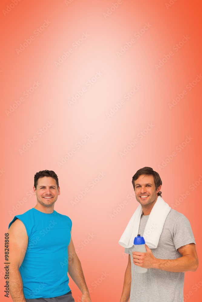 Fit men with water bottle and towel Fit men with water bottle and towel