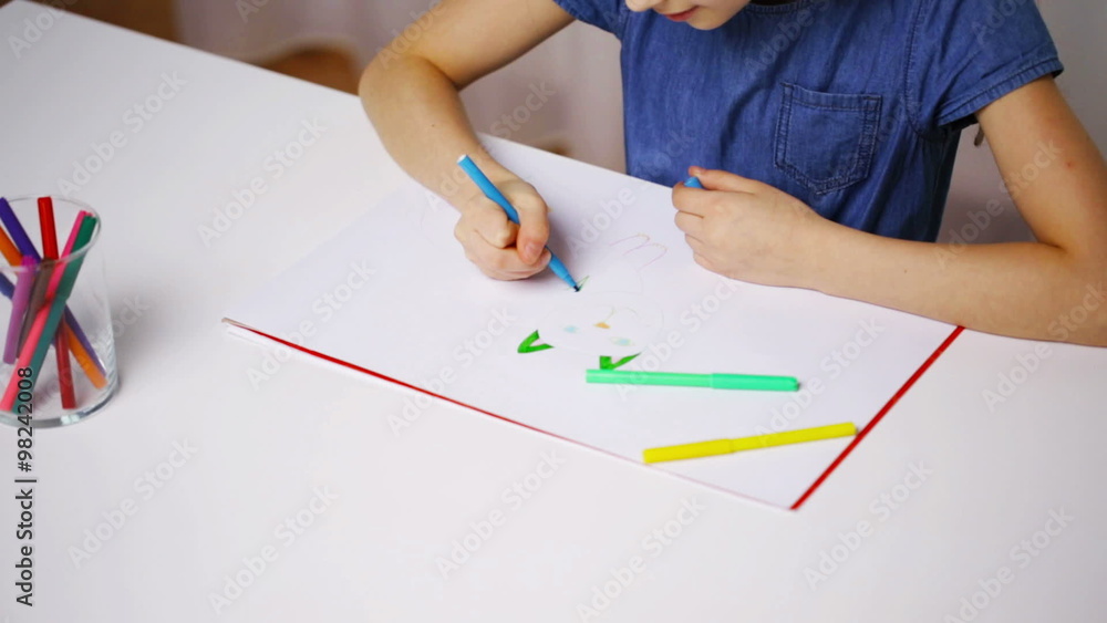 girl hands with colour pencil drawing cat on paper girl hands with colour pencil drawing cat on paper