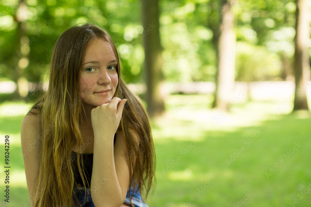 Teen girl closeup portrait in the Park. Teen girl closeup portrait in the Park.