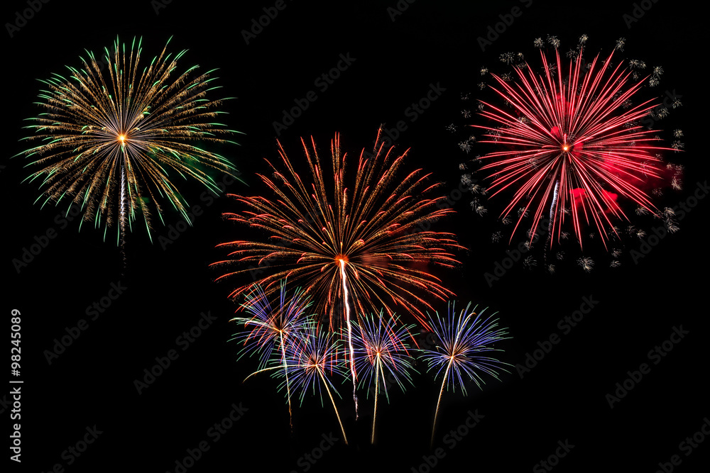 Colorful fireworks of various colors on black background