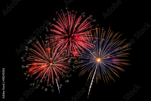 Colorful fireworks of various colors on black background