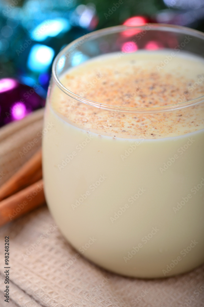 Glass of eggnog in a Christmas setting Glass of eggnog in a Christmas setting