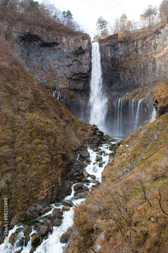 Japan waterfall with dry trees in autumn season