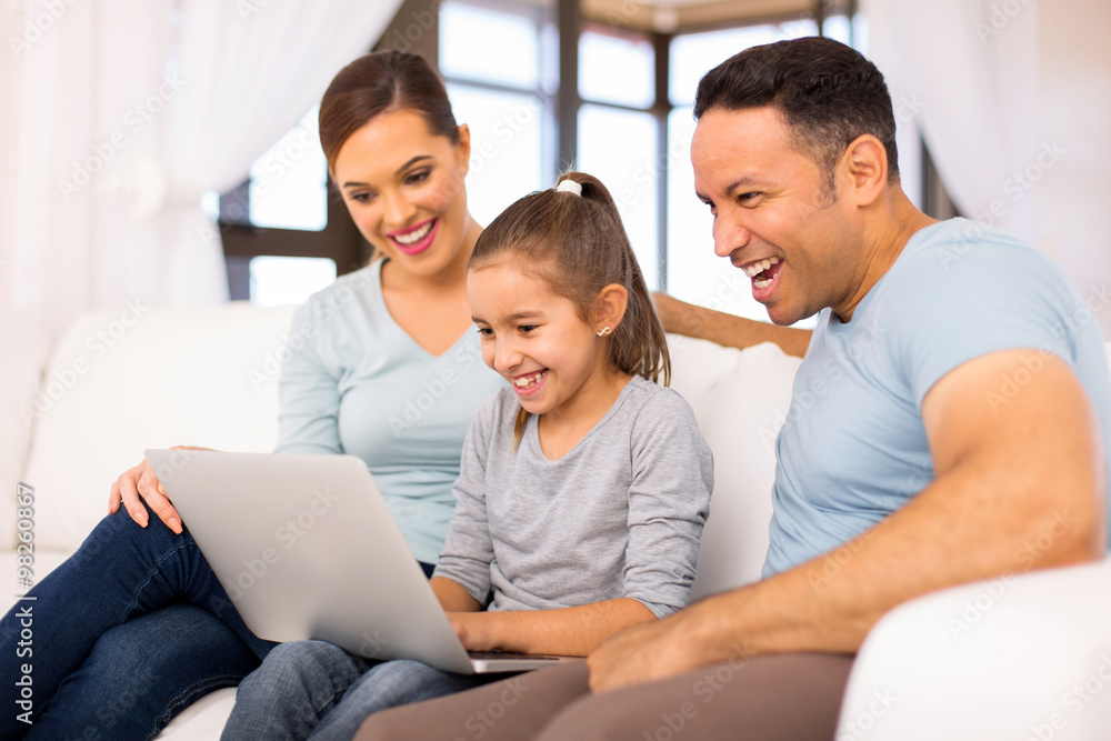 Fototapeta premium family using laptop computer at home