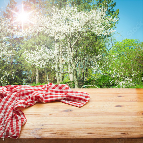 Empty table and tablecloth. Nature background outdoors.