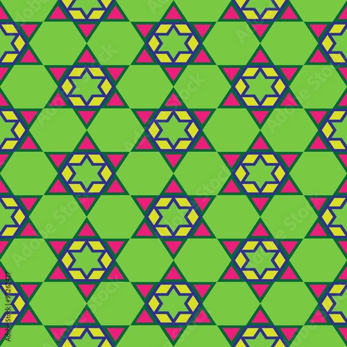 Abstract kaleidoscope seamless pattern for background. Colourful stars on green background.
