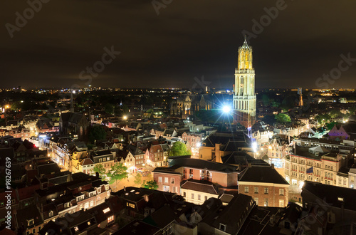 Cityscape of the city of Utrecht at night with the Dom cathedral lit by big lights