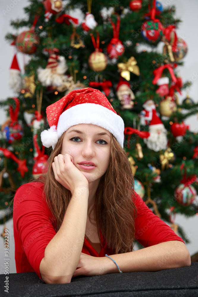 Beautiful girl in front of a Christmas tree Beautiful girl in front of a Christmas tree