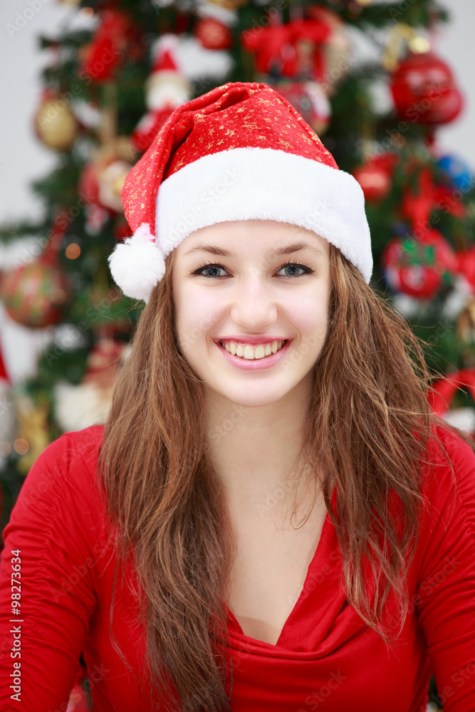Beautiful girl in front of a Christmas tree Beautiful girl in front of a Christmas tree