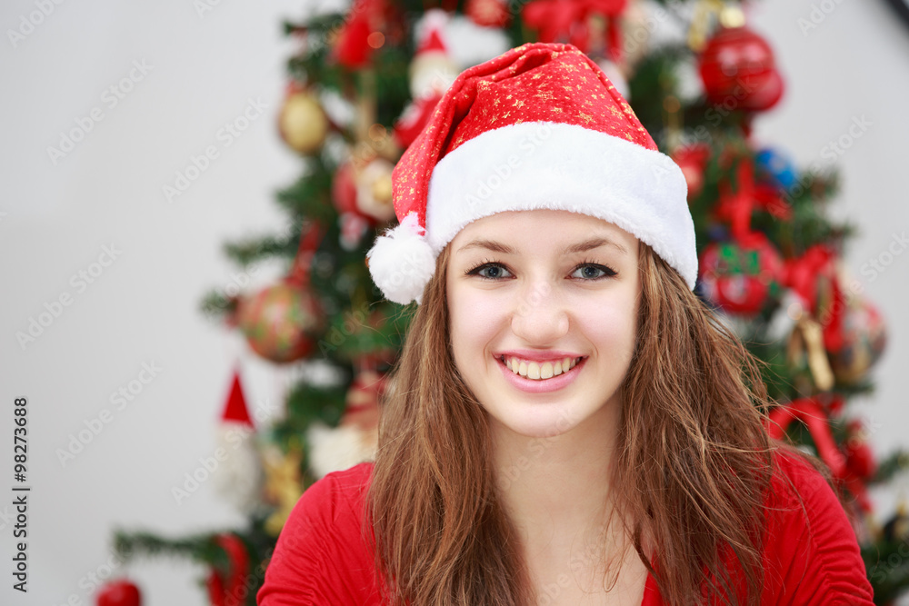 Beautiful girl in front of a Christmas tree Beautiful girl in front of a Christmas tree
