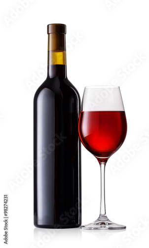 Red wine in glass with bottle