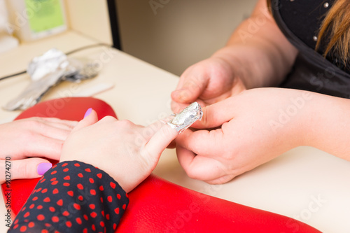 Manicurist Performing Gel Nail Manicure with Wraps
