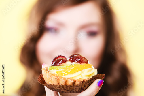 Cupcake cake in woman hand. Sweet food.
