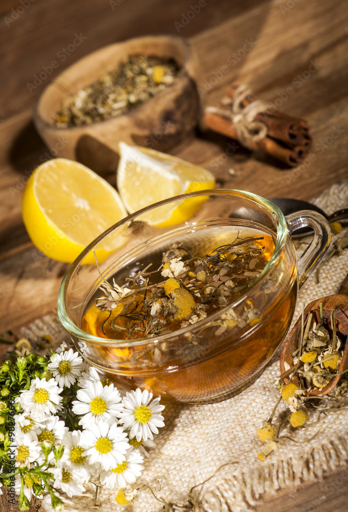 Fototapeta premium Chamomile tea on wooden background