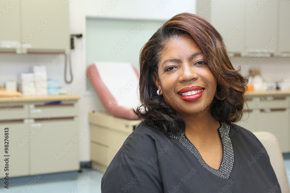 Attractive mature female African American nurse with big smile Attractive mature female African American nurse with big smile